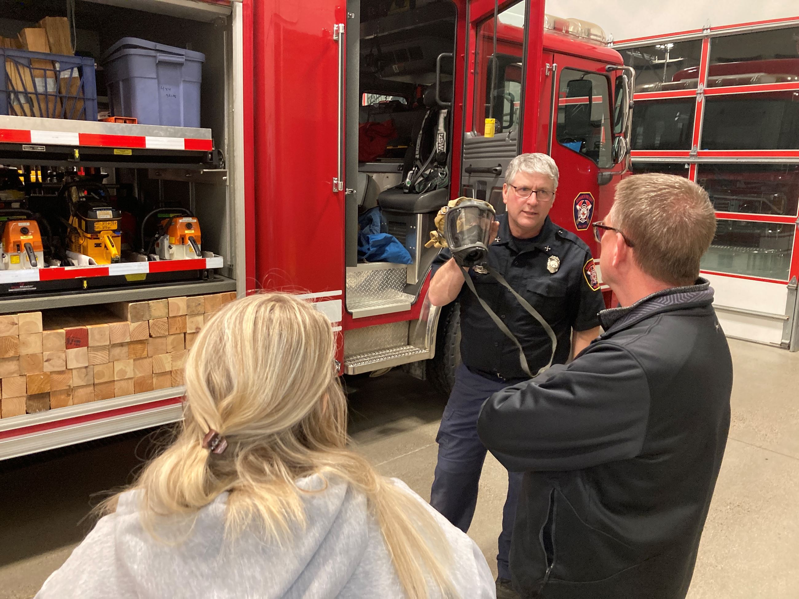 Citizen Academy tours one of the fire stations and looks at fire trucks. 