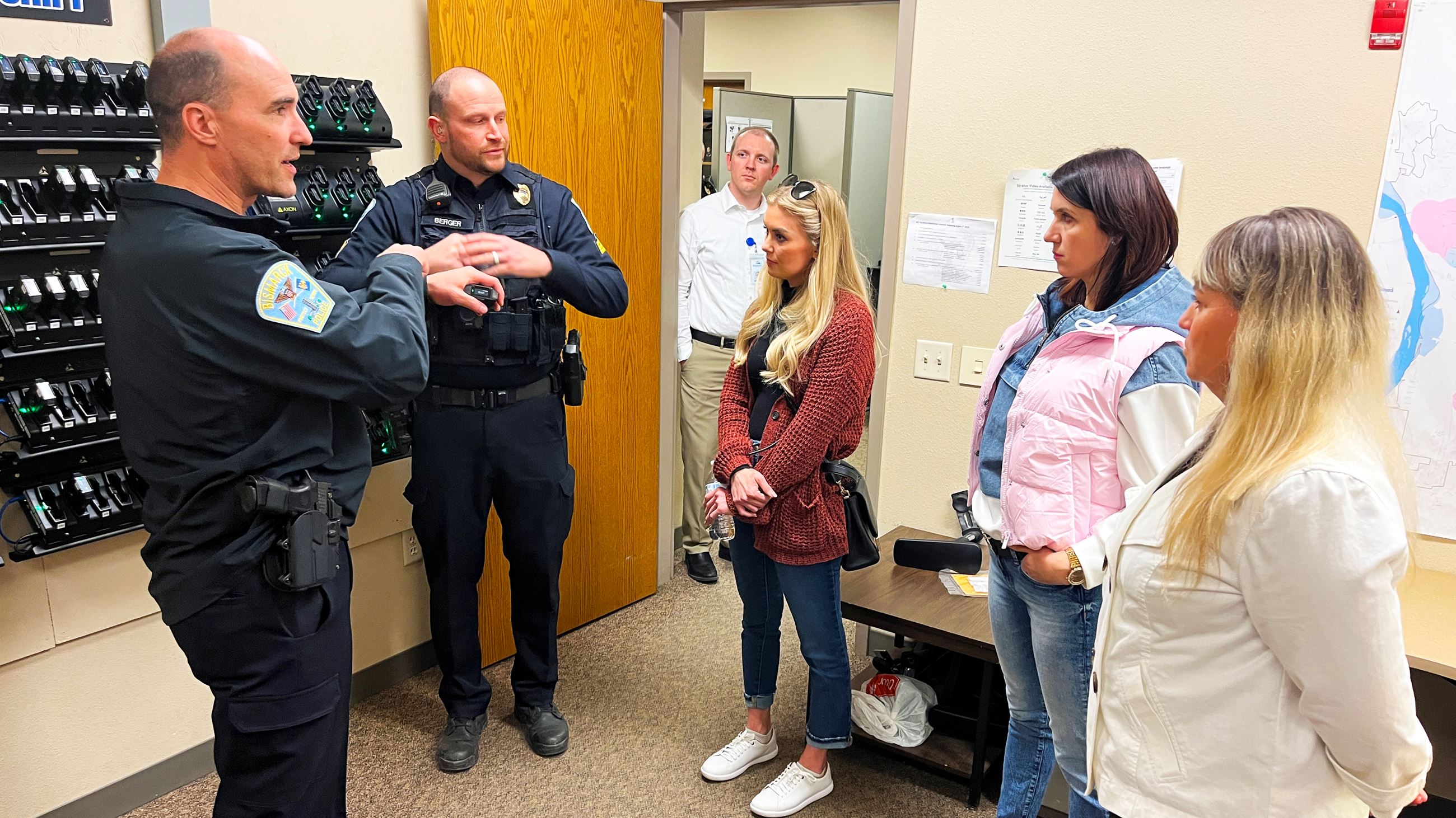 Bismarck PD officers explain how they utilize body cams during a Citizen Academy tour. 